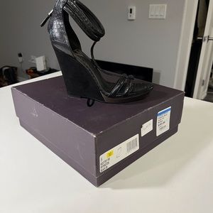 Exotic snakeskin/suede wedge.